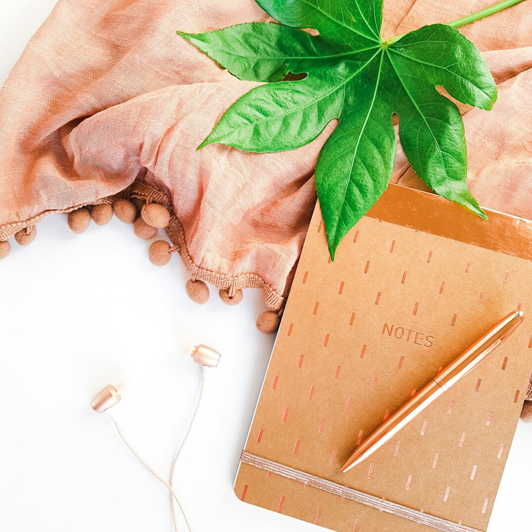 Notebook and pen on a wooden desk